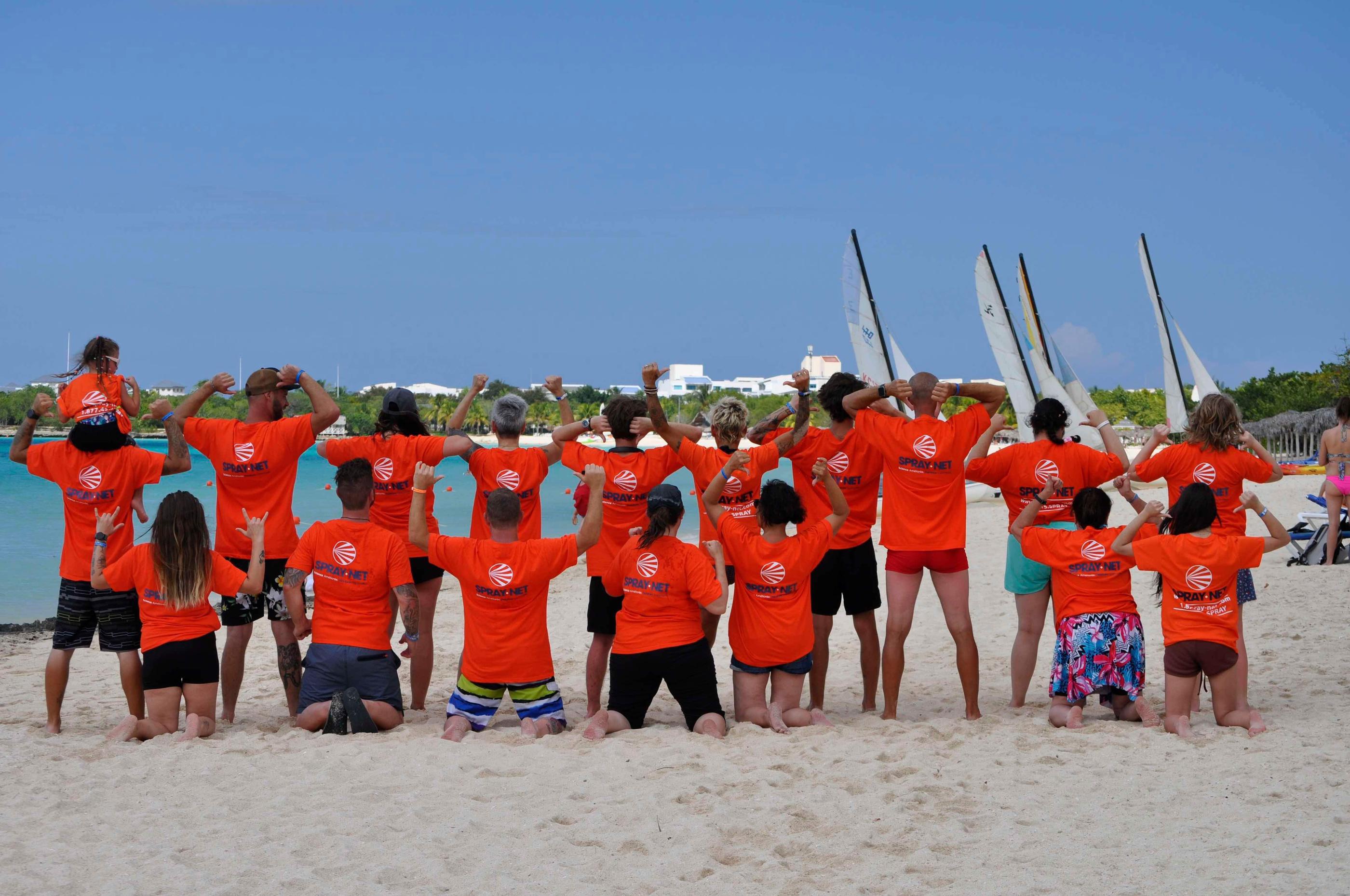 Spray-Net team standing together in front of a company truck.